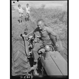 Mr Miller, OCC Works Depot employee cutting long grass in West Orange