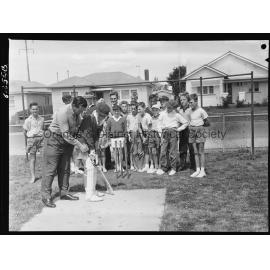 Jack Moroney coaching cricket at Orange East School