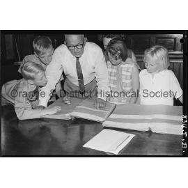 Mr R C Sheridan with Banjo Paterson's birth and baptism papers