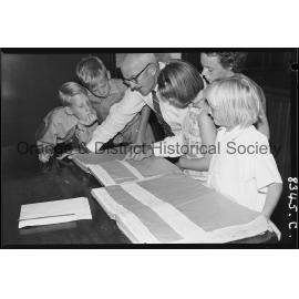 Mr R C Sheridan with Banjo Paterson's birth and baptism papers