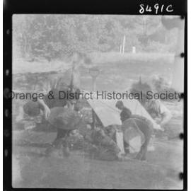 Scouts panning for gold