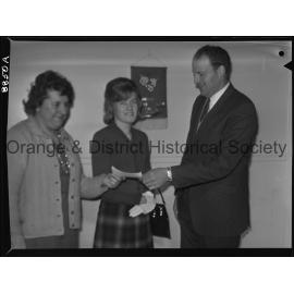 Miss Marcia Hampton hands over cheque