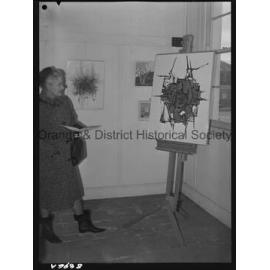 Art display, Mrs Sam Campbell studies abstract painting