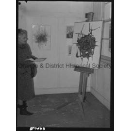 Art display, Mrs Sam Campbell studies abstract painting