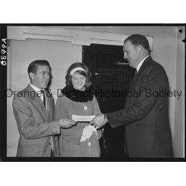 Miss Sandra Gale hands over cheque