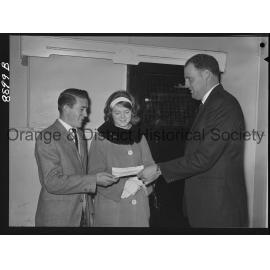 Miss Sandra Gale hands over cheque