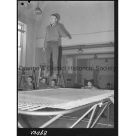 Billy Sarclat on trampoline at Police Citizens Boys' Club