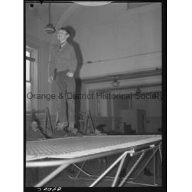 Billy Sarclat on trampoline at Police Citizens Boys' Club