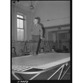 Billy Sarclat on trampoline at Police Citizens Boys' Club