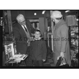 Mr R McDonald demonstrates electric hair clippers at Western Stores