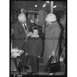 Mr R McDonald demonstrates electric hair clippers at Western Stores