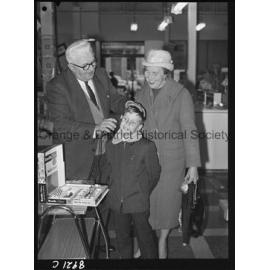 Mr R McDonald demonstrates electric hair clippers at Western Stores