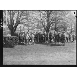 Legacy Week, people at Cenotaph watch on