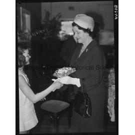 Kathleen Ratcliffe presents posy to Lady Moses