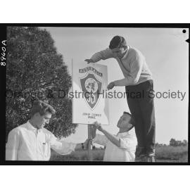 JC members erect a sign