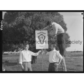 JC members erect a sign