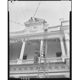 Painting around the Post Office clock