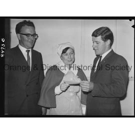 Nurse Rhonda McLean hands over cheque