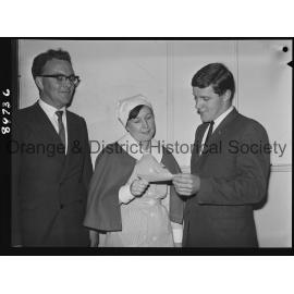 Nurse Rhonda McLean hands over cheque