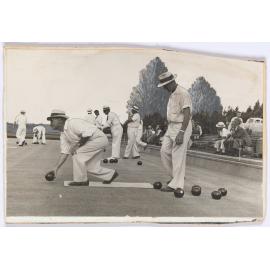 Men playing lawn bowls