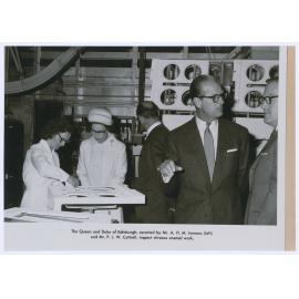 Queen Elizabeth and the Duke of Edinburgh inspect vitreous enamel work at the Email factory, Orange