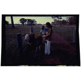 Woman and child with calves
