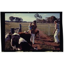 Woman and child with calves