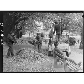 Council workmen cleaning up leaves