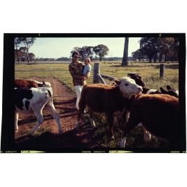 Woman and child with calves