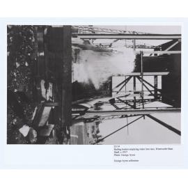 Bailing bucket emptying water into the race