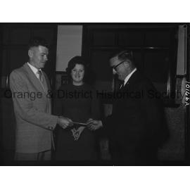 Cherry Blossom Queen candidate watches handover of festival cheque