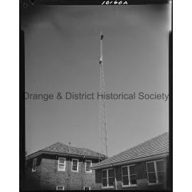 Affix aerial to radio tower at Ambulance Station