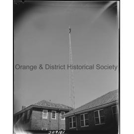 Affix aerial to radio tower at Ambulance Station