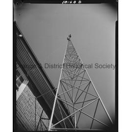Affix aerial to radio tower at Ambulance Station