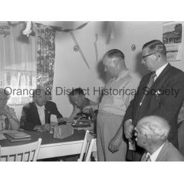 Bill Denman handing present to pensioners