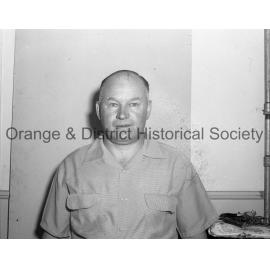 Bill Denman handing present to pensioners