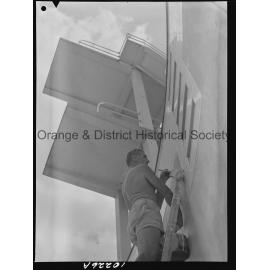 Olympic pool diving board gets a paint over