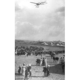 Photographed by W H Bursle a Bleriot type monoplane flying towards centre ring at the 1912 Orange Show