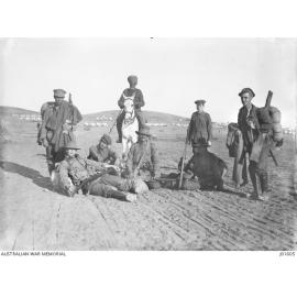 Australian soldiers newly arrived from Gallipoli, escorted by an Indian soldier on horseback, with all their kit, ready to enter rest camp on Lemnos Island