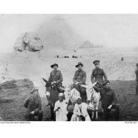 Officers of the 2nd Battalion with two Egyptian guides in front of the Sphinx during a visit to the Pyramids. 2nd Lieutenant Solling is seated on the donkey on the right.