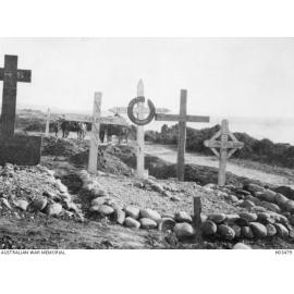 The white cross with black circle marks the grave of 2607 Private Horace Kurnell Weaver, Beach Cemetery, Gallipoli