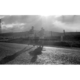 Three men running