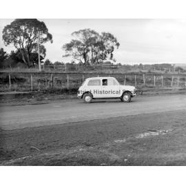 Mini car on road