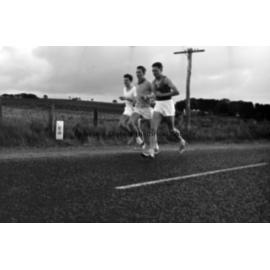 Three men running