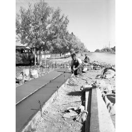 Men working on road in Sampson Street