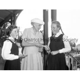 Mrs Matthews presents Jill Keevil & Sonya Latten with prizes at Rural School