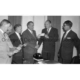 Ald Ridley receives cheque from Ex-Services Club & Mr Sullivans