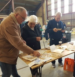 The Newham family, Craig, Noeline and Jeff opening the contents from the second envelope.