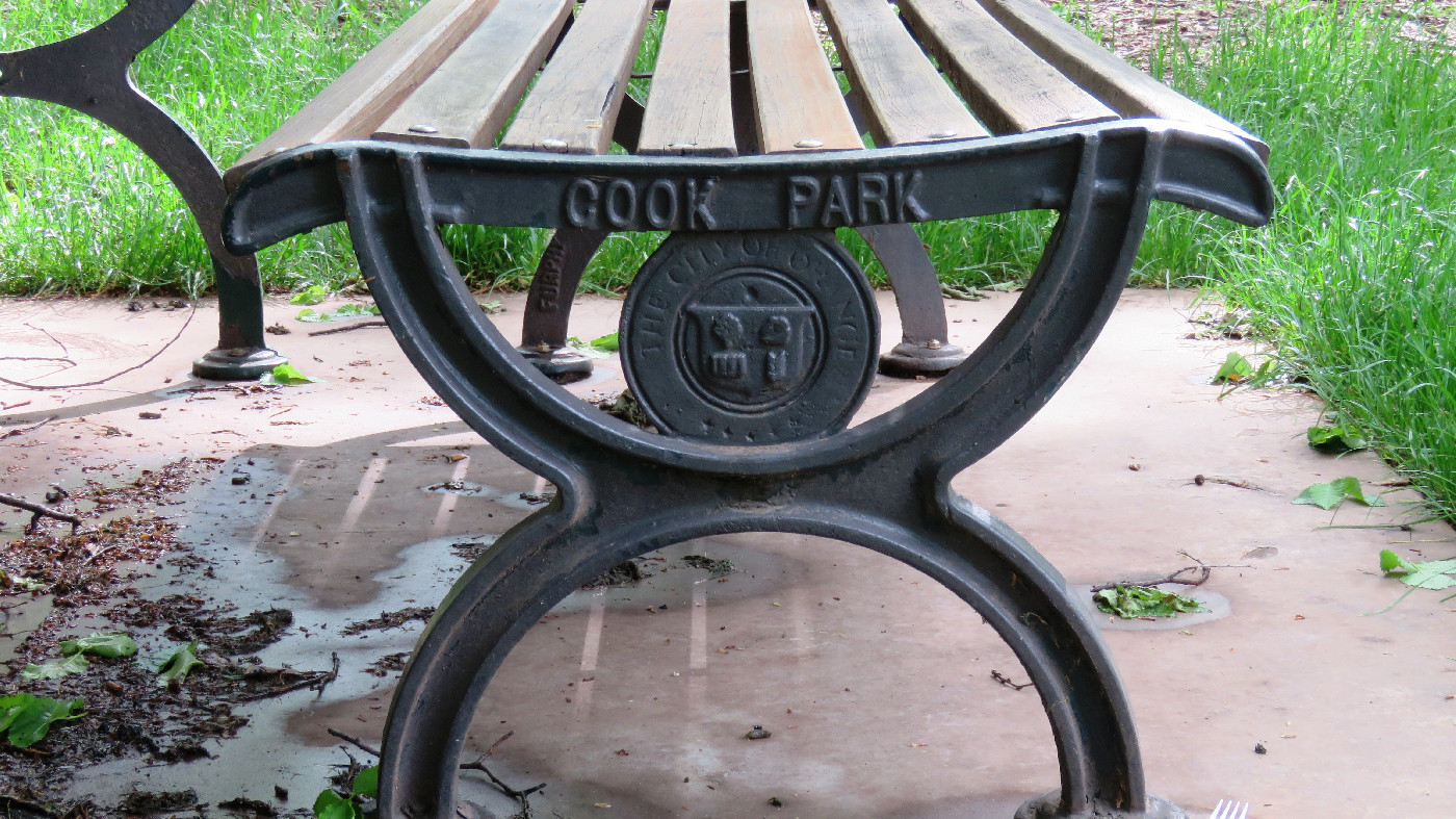 Orange City Council crest on seat in Cook Park, Orange